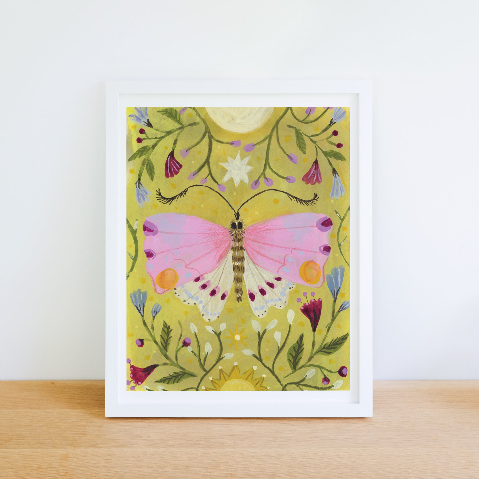 Framed artwork of a pink butterfly on a yellow floral background